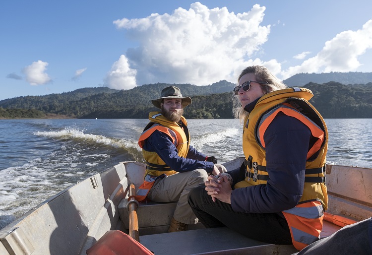 Photo of staff in a boat undertaking algae control on the Lower Nihotupu_dam